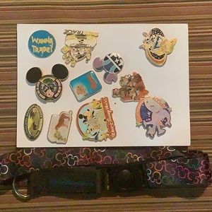 Eleven Assorted Disney Pins and Lanyard